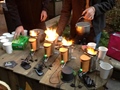 Fire powered cellphone charge station tea maker and mini-fireplace