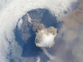 Erupting volcano view from space